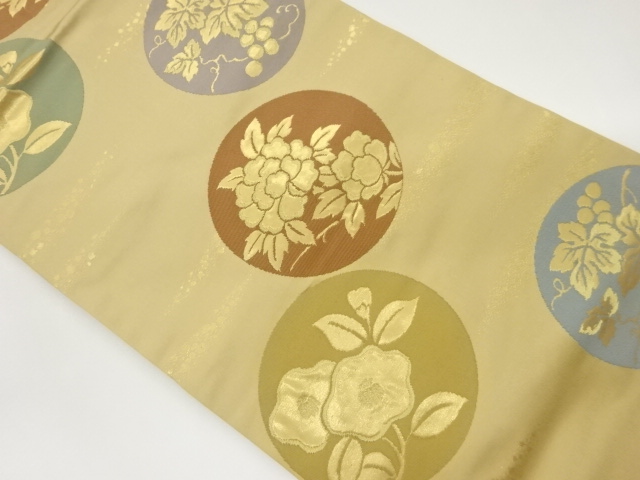 草花に唐草模様織出し名古屋帯